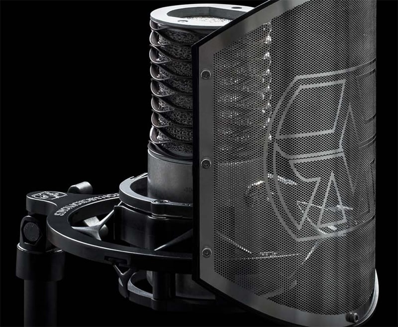 Aston Microphones Origin mounted on a shock mount with a shield.