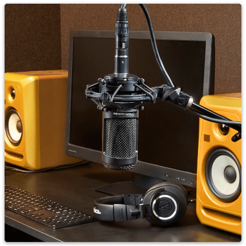 Audio-Technica AT2050 microphone on a boom arm.