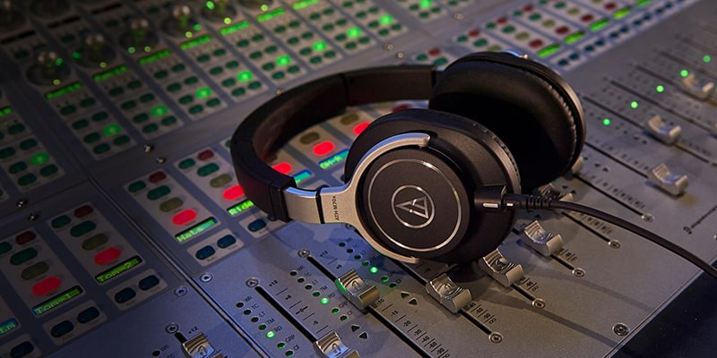 Audio-Technica ATH-M70x sitting on a mixing board.