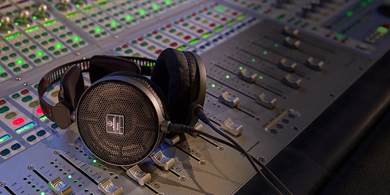Audio-Technica ATH-R70x sitting on a mixing console.