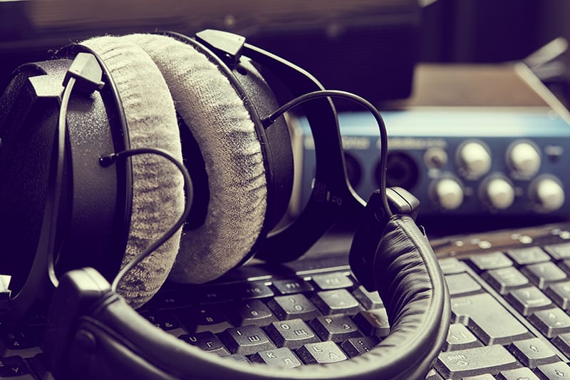 Beyerdynamic headphones sitting on a keyboard.