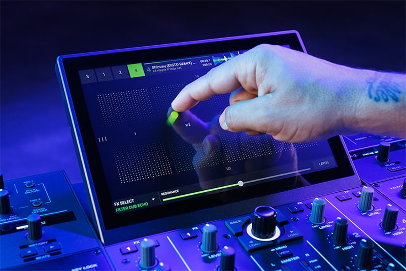 DJ using the FX on the screen of a Denon Prime 4 Plus.