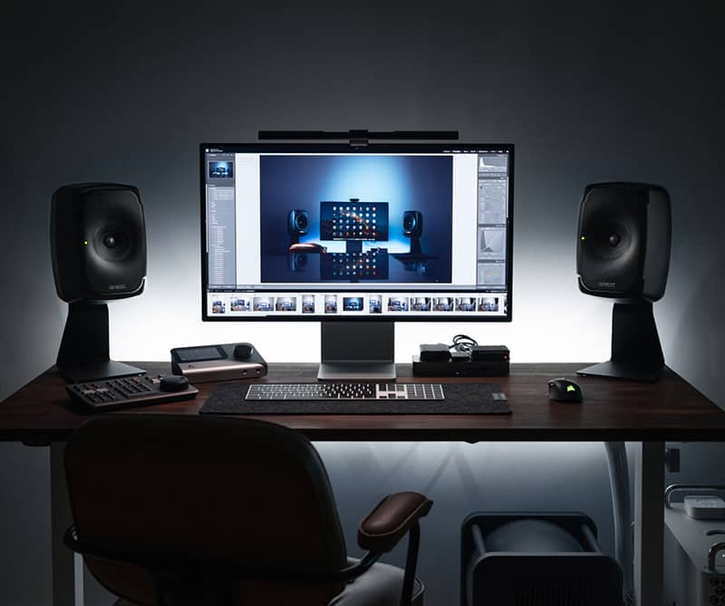 Home studio with Genelec 8331 monitors next to a computer.