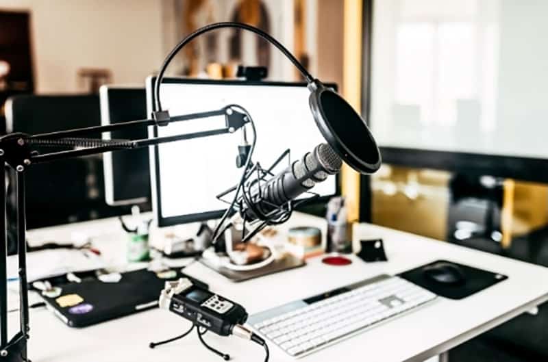 Photo of a multimedia studio with workstation and microphone