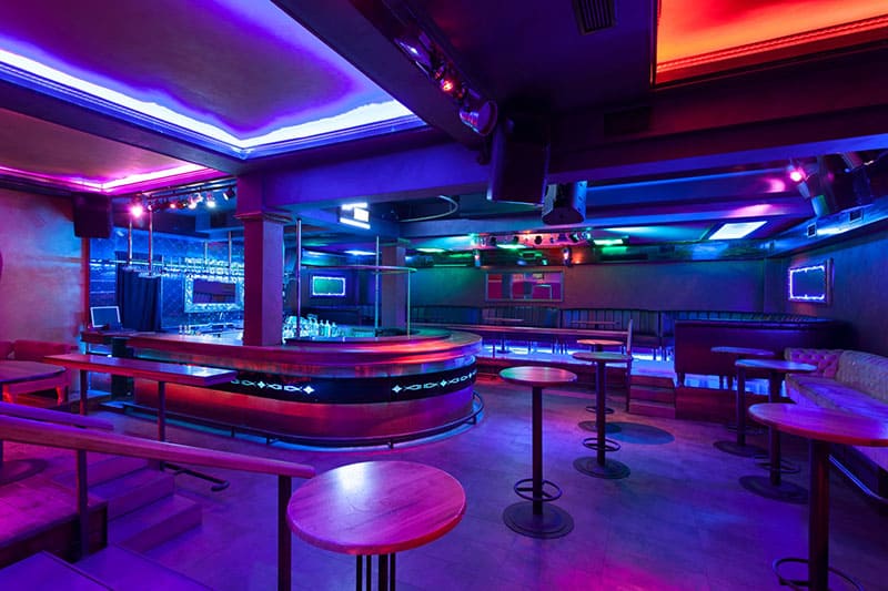 Empty nightclub with colorful lights.