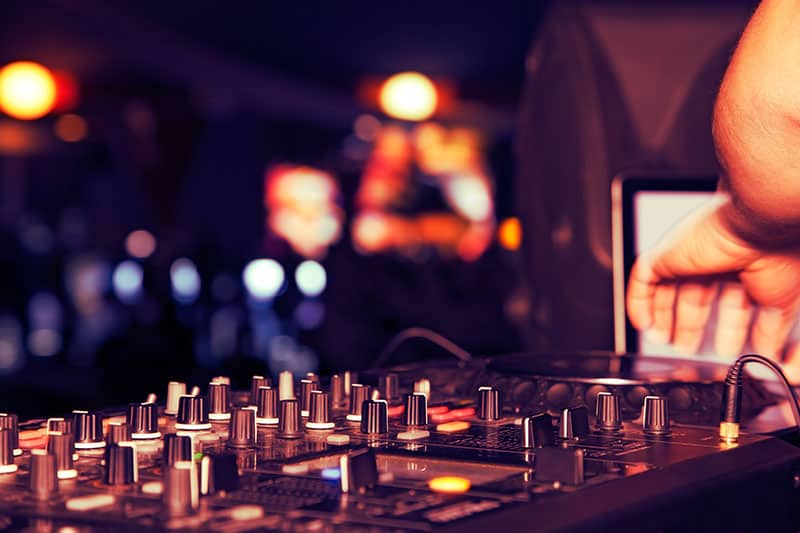 DJ using professional DJ equipment