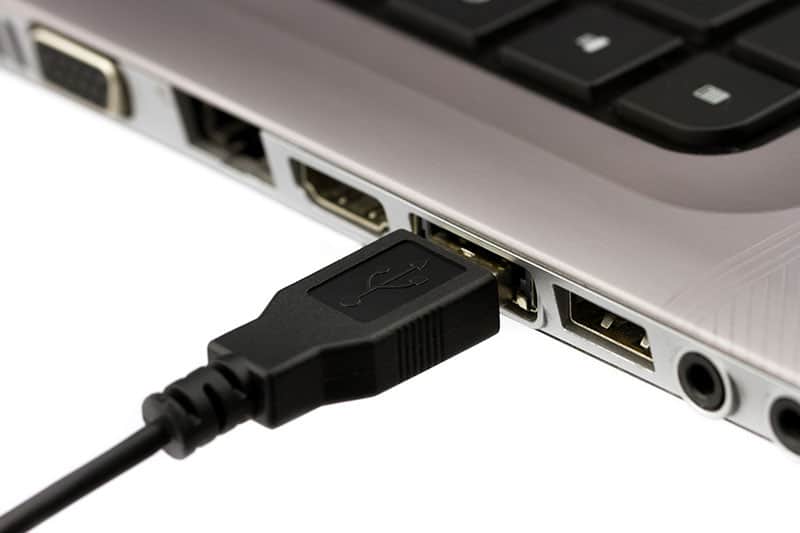 USB cable plugged into a laptop