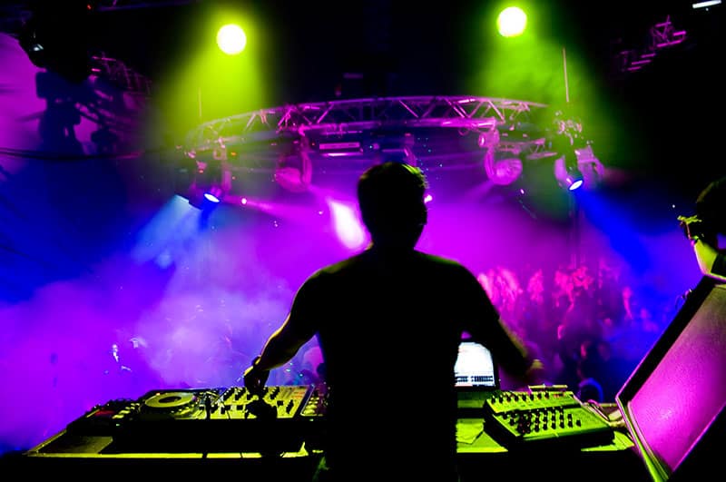 DJ performing in front of a crowd.
