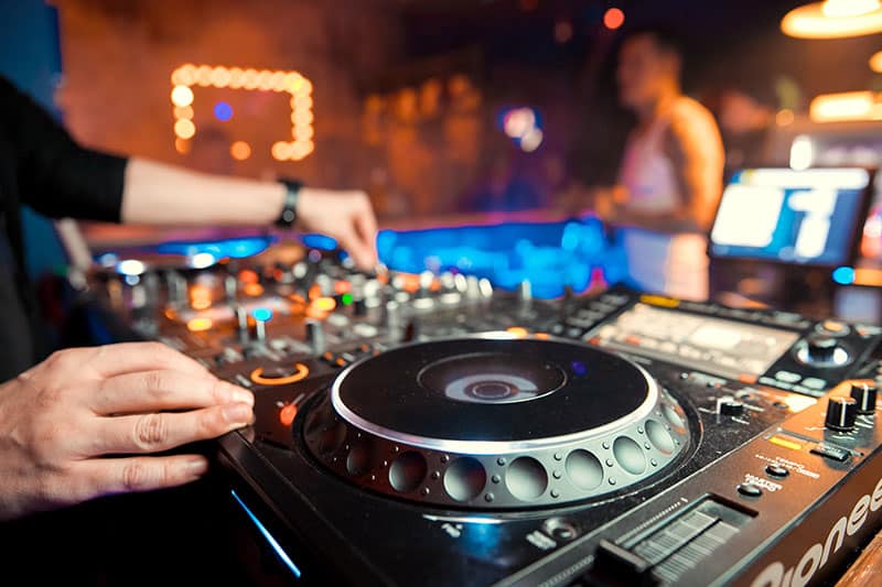 DJ using professional equipment in a night club