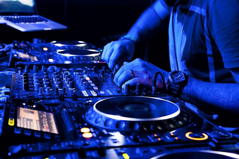 DJ using professional DJ equipment