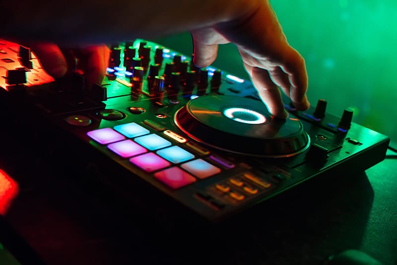 DJ performing using a DJ controller.