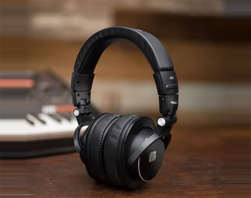 PreSonus HD9 sitting on a wooden desk with a keyboard in the background.