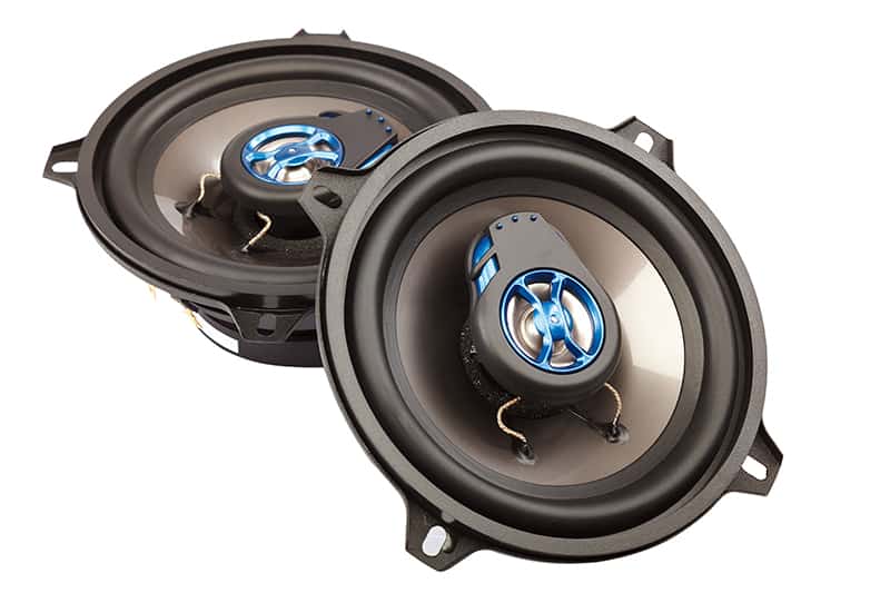 Two car speakers on a white background.