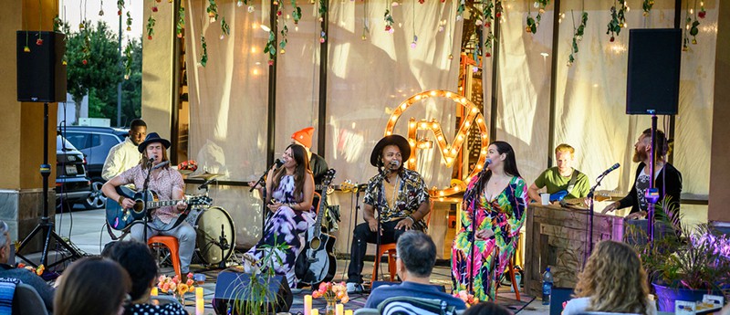 A band performing and using QSC K10.2 loudspeakers.