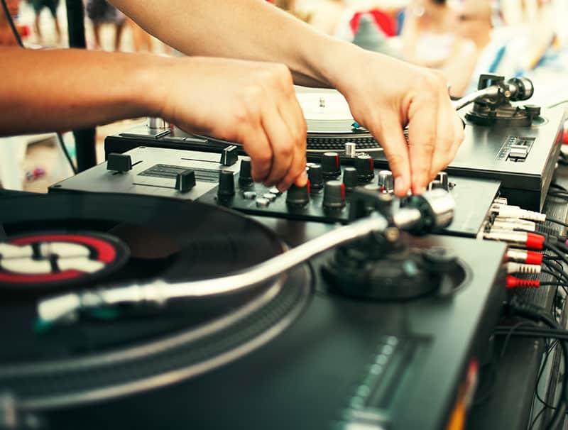 DJ mixing music using vinyl.