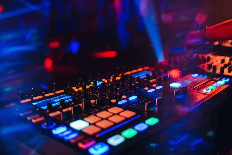 DJ using a Traktor controller in a club.