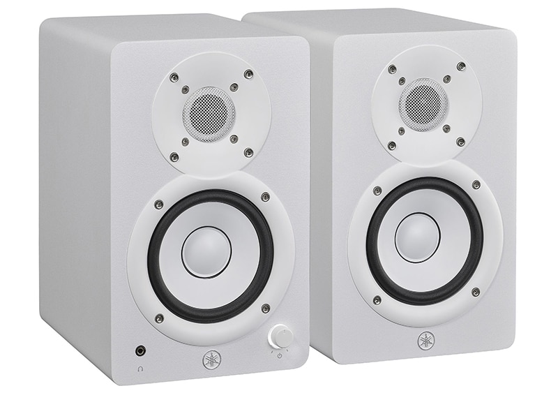 A white pair of Yamaha HS4 studio monitors.