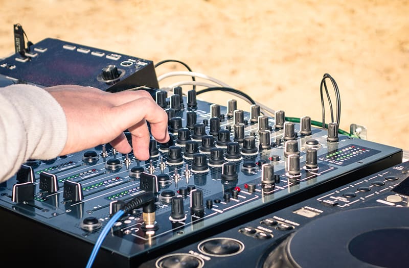 DJ using a professional DJ mixer.