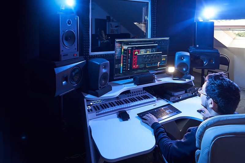 Man working in a professional music studio.