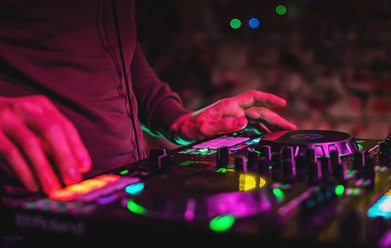 DJ performing using a 2-channel DJ controller.