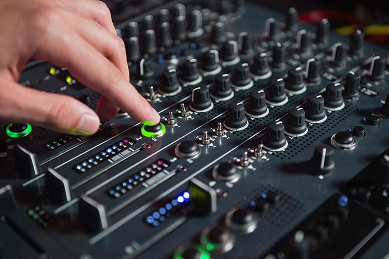Close up photo of a DJ mixer.
