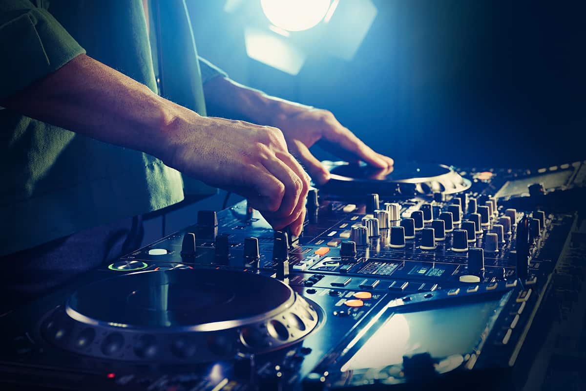 DJ using professional DJ equipment.