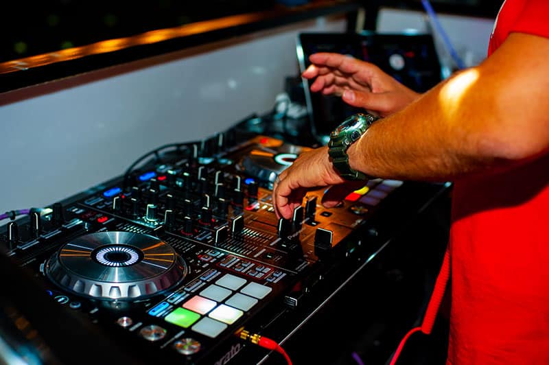 DJ using a DJ controller