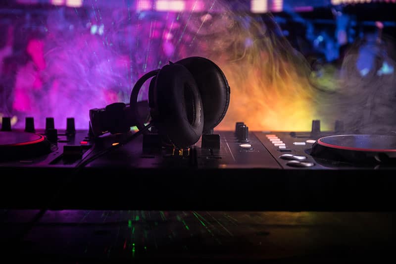 DJ Headphones sitting on top of DJ equipment