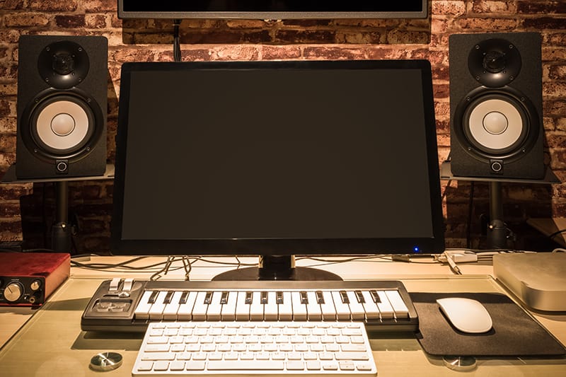 Photo of a small music production studio.
