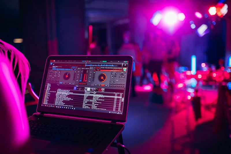 Laptop with DJ software on the screen.