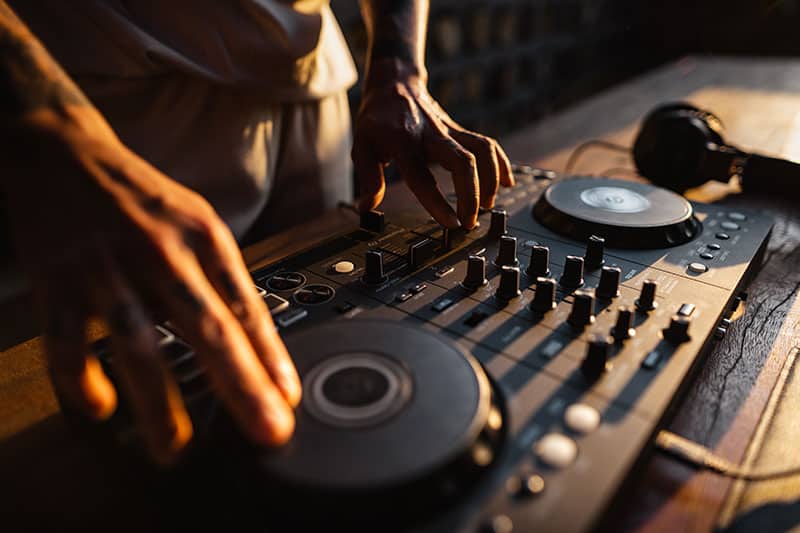 DJ using a DJ controller.