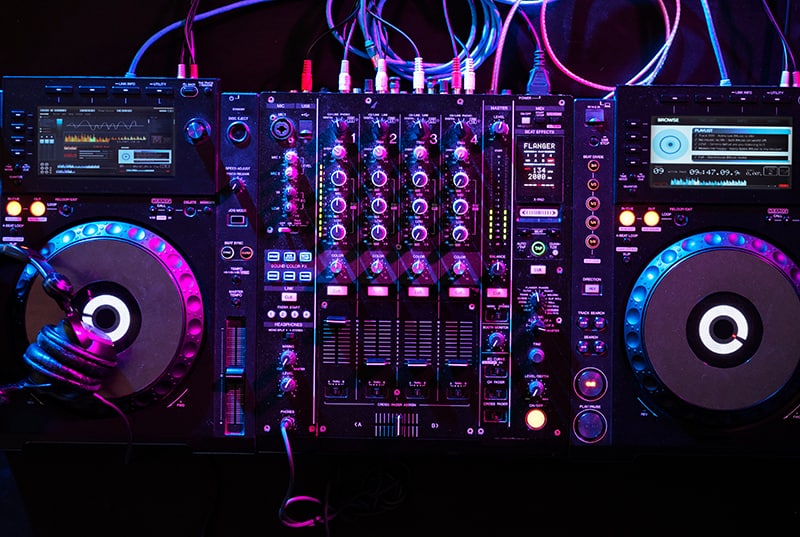 Top view of a DJ mixer and media players.