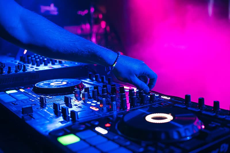 DJ playing on a Pioneer DJ Controller