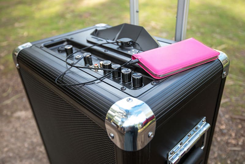 Mobile phone connected to a portable PA system