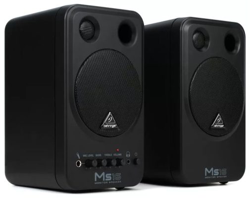 Three quarter view of a pair of Behringer MS16 studio monitors.