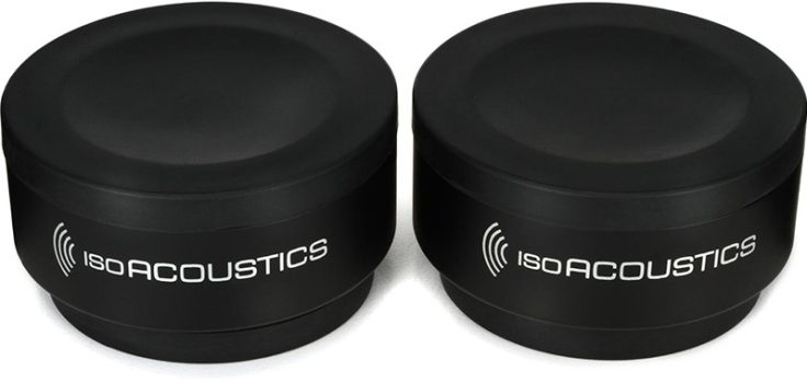 Three quarter view of the IsoAcoustics ISO-PUCK isolation discs.